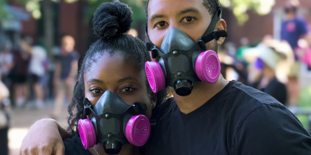 Pink face masks on a black couple