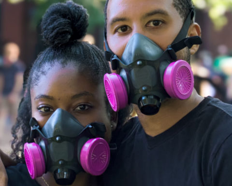 Pink face masks on a black couple